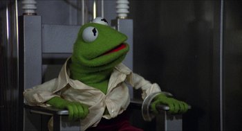 Movie still from “The Muppet Movie” (1979), directed by James Frawley – A stuffed animal wearing a shirt; Medium shot, Low angle