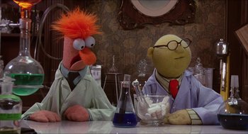Movie still from “The Muppet Movie” (1979), directed by James Frawley – A couple of muppets sitting at a table; Medium shot, Low angle