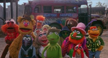 Movie still from “The Muppet Movie” (1979), directed by James Frawley – A group of muppets standing in front of an electric mayhem bus; Wide shot, High angle