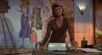Movie still from “The Muppet Movie” (1979), directed by James Frawley – A woman standing in front of a laptop computer; Medium shot, Low angle
