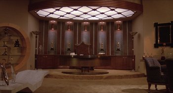 Movie still from “The Muppet Movie” (1979), directed by James Frawley – A room that has a chair in the middle of the room; Extreme Wide shot, Low angle