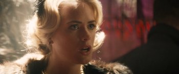 Movie still from “The Night Before” (2015), directed by Jonathan Levine – A person with blonde hair; Close Up shot, Over the shoulder angle