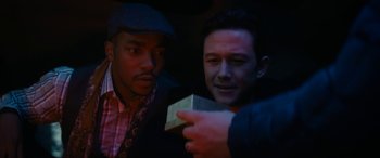 Movie still from “The Night Before” (2015), directed by Jonathan Levine – Two men looking at each other while holding a piece of paper; Close Up shot, Over the shoulder angle