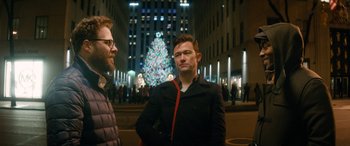 Movie still from “The Night Before” (2015), directed by Jonathan Levine – Two men standing in front of a lit christmas tree; Close Up shot, Over the shoulder angle