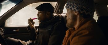 Movie still from “The Night Before” (2015), directed by Jonathan Levine – Two men sitting in the back seat of a car; Medium shot, Low angle