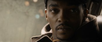Movie still from “The Night Before” (2015), directed by Jonathan Levine – A person wearing a jacket and a hat; Close Up shot, Over the shoulder angle