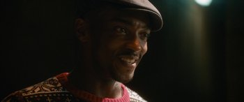 Movie still from “The Night Before” (2015), directed by Jonathan Levine – A person wearing a hat; Close Up shot, Over the shoulder angle