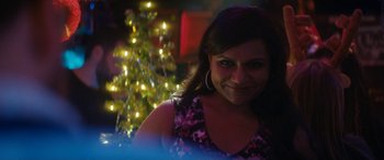 Movie still from “The Night Before” (2015), directed by Jonathan Levine – A person near a christmas tree; Close Up shot, Over the shoulder angle