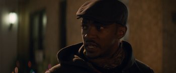 Movie still from “The Night Before” (2015), directed by Jonathan Levine – A person wearing a hat; Close Up shot, Over the shoulder angle