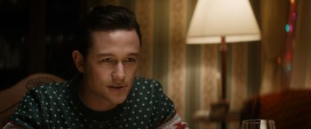 Movie still from “The Night Before” (2015), directed by Jonathan Levine – A person sitting in a room; Close Up shot, Over the shoulder angle