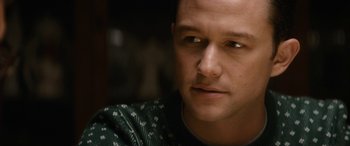 Movie still from “The Night Before” (2015), directed by Jonathan Levine – A person wearing a green shirt; Close Up shot, Over the shoulder angle