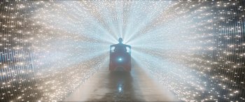Movie still from “The Night Before” (2015), directed by Jonathan Levine – A man riding a train in the middle of a tunnel; Extreme Wide shot, Low angle