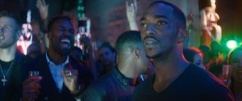 Movie still from “The Night Before” (2015), directed by Jonathan Levine – A group of young men standing in front of a crowd; Close Up shot, Low angle