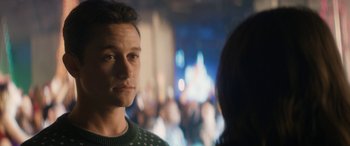 Movie still from “The Night Before” (2015), directed by Jonathan Levine – A man in a green sweater is looking at a woman; Close Up shot, Over the shoulder angle