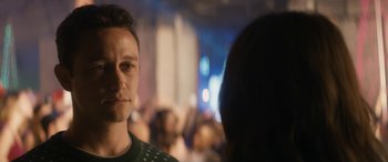 Movie still from “The Night Before” (2015), directed by Jonathan Levine – A person wearing a green sweater; Close Up shot, Over the shoulder angle