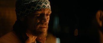 Movie still from “The Night Before” (2015), directed by Jonathan Levine – A person wearing a hat; Close Up shot, Over the shoulder angle