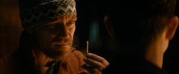 Movie still from “The Night Before” (2015), directed by Jonathan Levine – A person holding a cigarette; Close Up shot, Over the shoulder angle