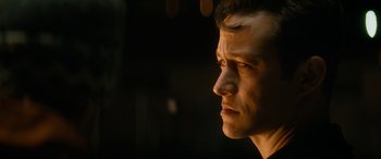Movie still from “The Night Before” (2015), directed by Jonathan Levine – A person's face in the dark; Close Up shot, Over the shoulder angle