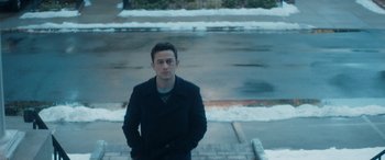 Movie still from “The Night Before” (2015), directed by Jonathan Levine – A man standing on the side of the road in the snow; Medium shot, High angle