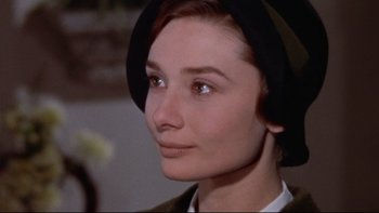 Movie still from “The Nun's Story” (1959), directed by Fred Zinnemann – A person wearing a hat; Close Up shot, Over the shoulder angle