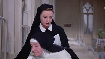 Movie still from “The Nun's Story” (1959), directed by Fred Zinnemann – A nun and a woman in black and white clothes; Close Up shot, Low angle