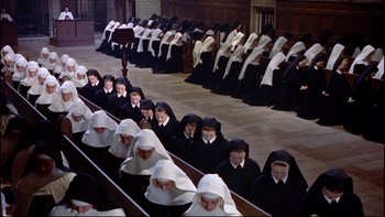 Movie still from “The Nun's Story” (1959), directed by Fred Zinnemann – A group of women in black and white dresses; Extreme Wide shot, High angle