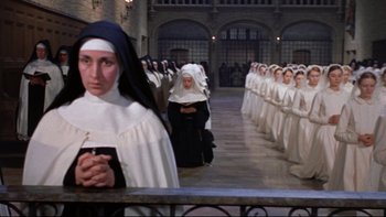 Movie still from “The Nun's Story” (1959), directed by Fred Zinnemann – A group of nuns standing next to each other in a line; Wide shot, High angle