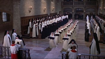 Movie still from “The Nun's Story” (1959), directed by Fred Zinnemann – A large group of women in white and black dresses; Extreme Wide shot, High angle