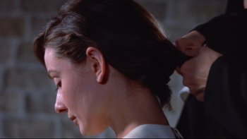 Movie still from “The Nun's Story” (1959), directed by Fred Zinnemann – A woman getting her hair done by a stylist; Close Up shot, Over the shoulder angle