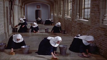 Movie still from “The Nun's Story” (1959), directed by Fred Zinnemann – A group of nuns cleaning the floor of a building; Wide shot, High angle