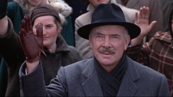 Movie still from “The Nun's Story” (1959), directed by Fred Zinnemann – An older man with a mustache wearing a black hat; Close Up shot, Low angle