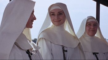 Movie still from “The Nun's Story” (1959), directed by Fred Zinnemann – Two women dressed as nuns smiling for the camera; Close Up shot, Low angle