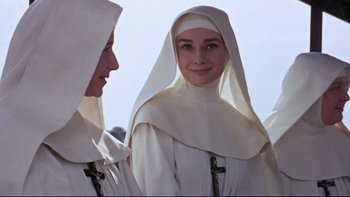 Movie still from “The Nun's Story” (1959), directed by Fred Zinnemann – Two women dressed as nuns standing next to each other; Close Up shot, Low angle