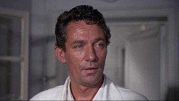 Movie still from “The Nun's Story” (1959), directed by Fred Zinnemann – A person wearing a white shirt; Close Up shot, High angle