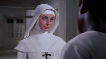 Movie still from “The Nun's Story” (1959), directed by Fred Zinnemann – Audrey hepburn in a nun's outfit in the nun's story; Close Up shot, Over the shoulder angle