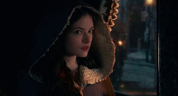 Movie still from “The Nutcracker and the Four Realms” (2018), directed by Joe Johnston – A young woman with a hood over her head; Close Up shot, High angle