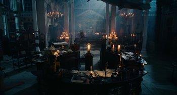 Movie still from “The Nutcracker and the Four Realms” (2018), directed by Joe Johnston – A room filled with lots of lit candles and papers; Extreme Wide shot, High angle