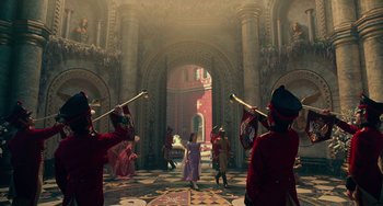 Movie still from “The Nutcracker and the Four Realms” (2018), directed by Joe Johnston – A group of people in a room with a bunch of statues; Extreme Wide shot, Low angle