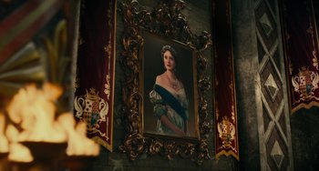 Movie still from “The Nutcracker and the Four Realms” (2018), directed by Joe Johnston – A painting of a woman with a crown hanging on the wall; Medium shot, Low angle