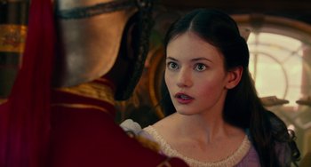 Movie still from “The Nutcracker and the Four Realms” (2018), directed by Joe Johnston – A young woman looking into a mirror while wearing a white dress; Close Up shot, Over the shoulder angle