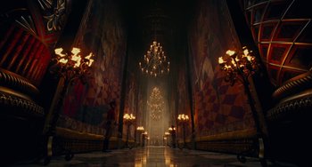 Movie still from “The Nutcracker and the Four Realms” (2018), directed by Joe Johnston – A large room with a chandelier and a large painting on the wall; Extreme Wide shot, Low angle