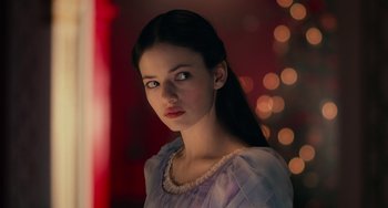 Movie still from “The Nutcracker and the Four Realms” (2018), directed by Joe Johnston – A young woman with long black hair wearing a blue dress; Close Up shot, Low angle