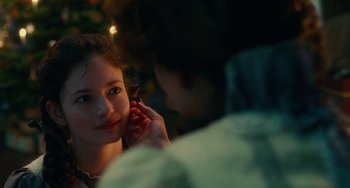 Movie still from “The Nutcracker and the Four Realms” (2018), directed by Joe Johnston – A woman is talking on a cell phone while a man is talking on a cell phone; Close Up shot, Over the shoulder angle