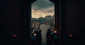 Movie still from “The Nutcracker and the Four Realms” (2018), directed by Joe Johnston – A group of people standing on top of a wooden bridge; Extreme Wide shot, High angle