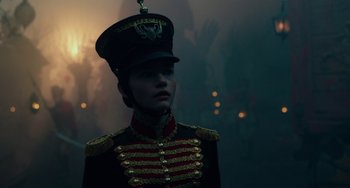 Movie still from “The Nutcracker and the Four Realms” (2018), directed by Joe Johnston – A man in a military uniform wearing a hat; Close Up shot, Over the shoulder angle