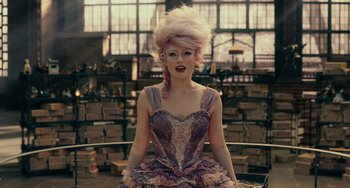 Movie still from “The Nutcracker and the Four Realms” (2018), directed by Joe Johnston – A woman in a purple dress and a pink wig; Medium shot, Low angle