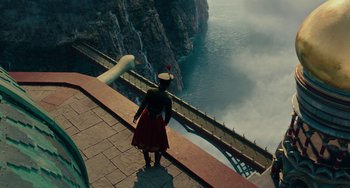Movie still from “The Nutcracker and the Four Realms” (2018), directed by Joe Johnston – A person standing on the side of a bridge; Extreme Wide shot, High angle