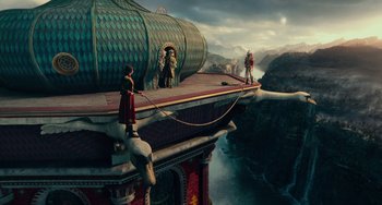 Movie still from “The Nutcracker and the Four Realms” (2018), directed by Joe Johnston – A group of people standing on top of a building; Extreme Wide shot, High angle