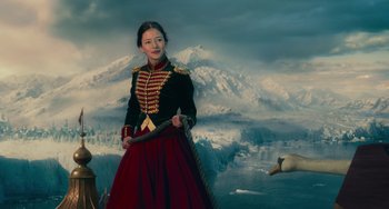 Movie still from “The Nutcracker and the Four Realms” (2018), directed by Joe Johnston – A woman dressed in a military uniform holding a sword; Medium shot, Low angle