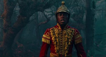 Movie still from “The Nutcracker and the Four Realms” (2018), directed by Joe Johnston – A man in a red and gold military uniform; Close Up shot, Low angle
